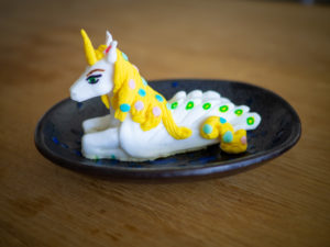 Unicorn take topper made out of modeling chocolate. Replica of a plastic figurine
